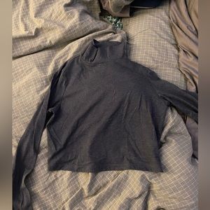 Cropped turtle neck shirt.